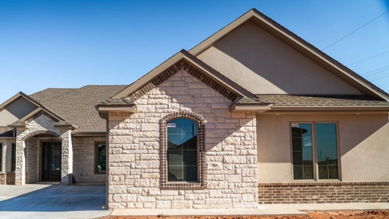 Completed home exterior with finished fascia along the roof edges