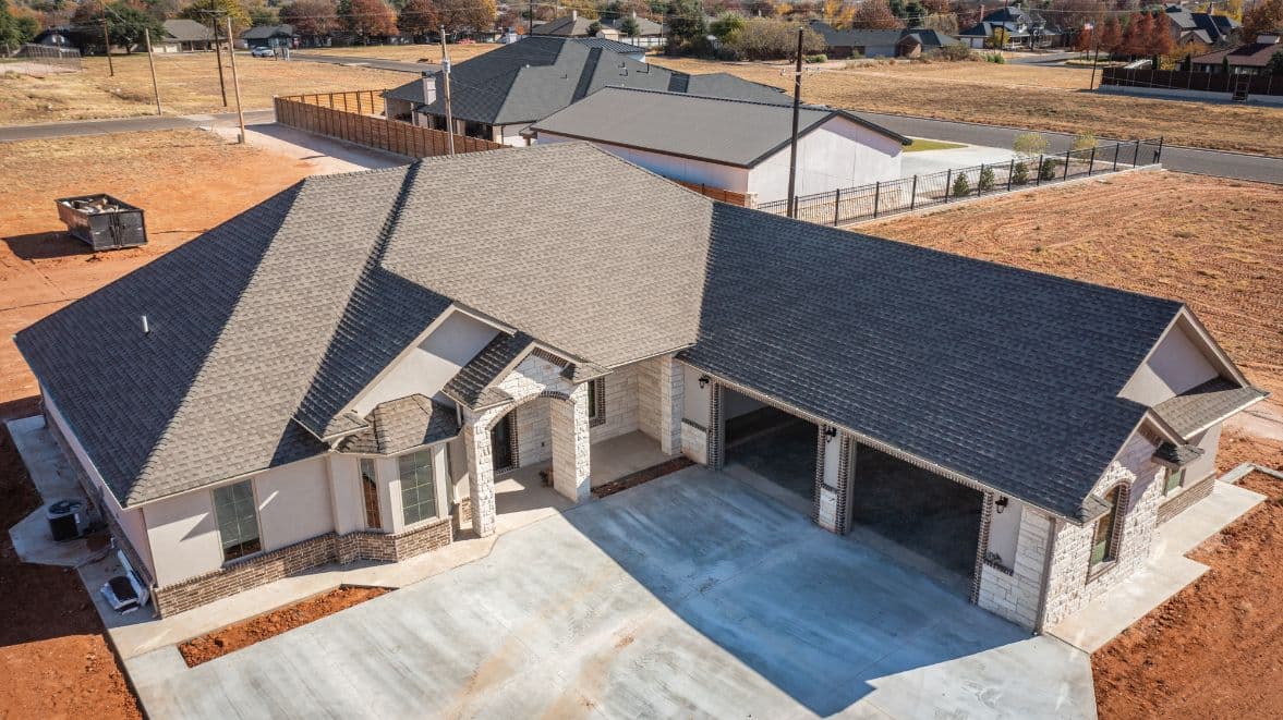 Aerial view of the completed home with finished roof edges