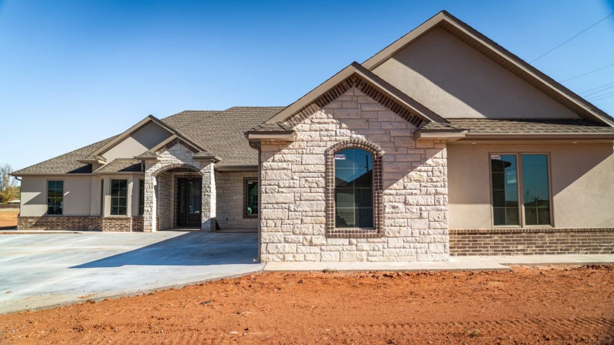 Completed home exterior with gutters along the roofline