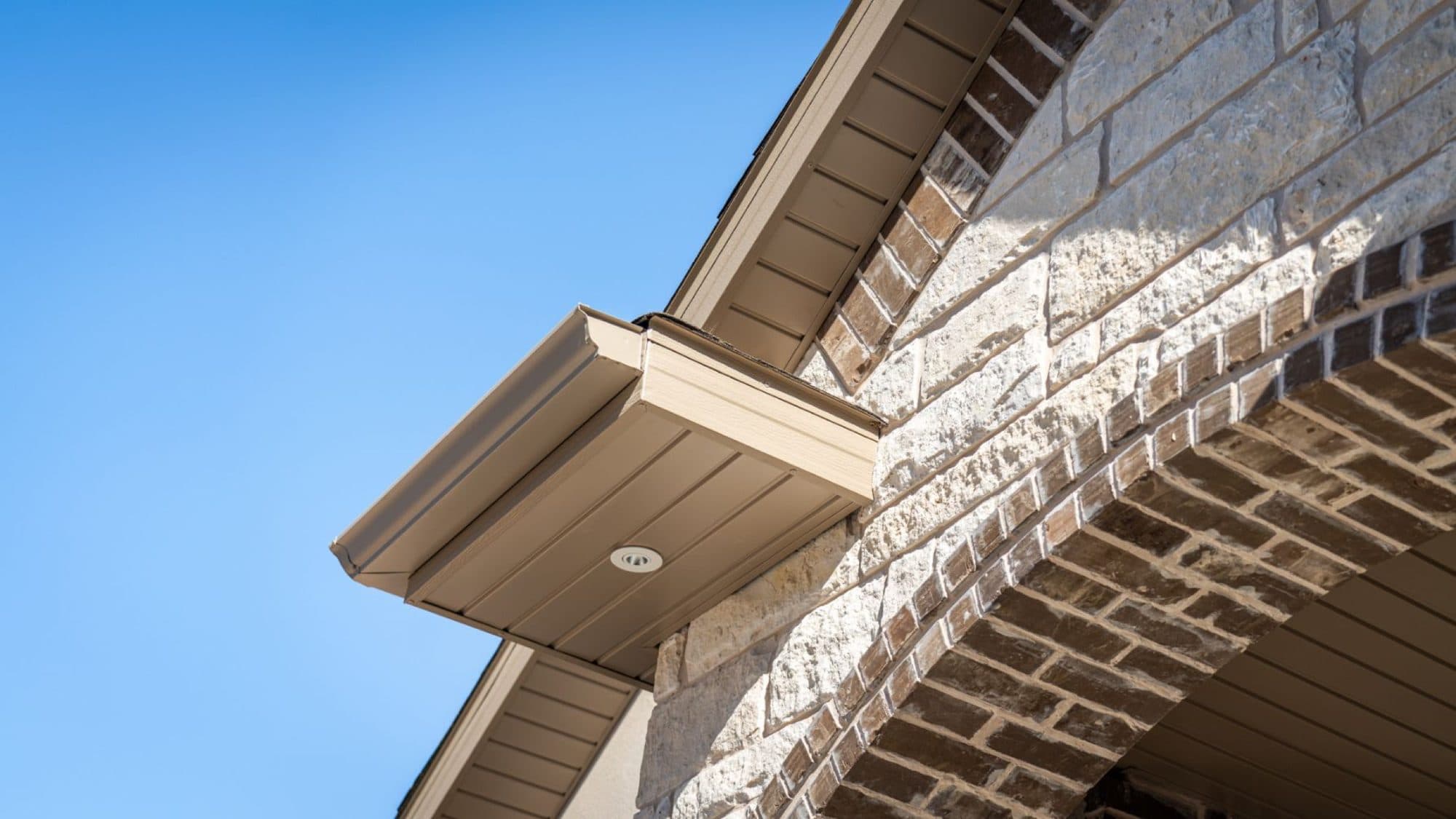 Soffit and fascia detail above a brick arch